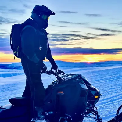 Snowmobile tour through winter wonderland