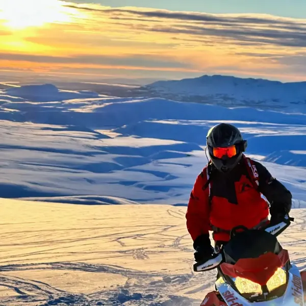 Guest on snowmobile winter adventure